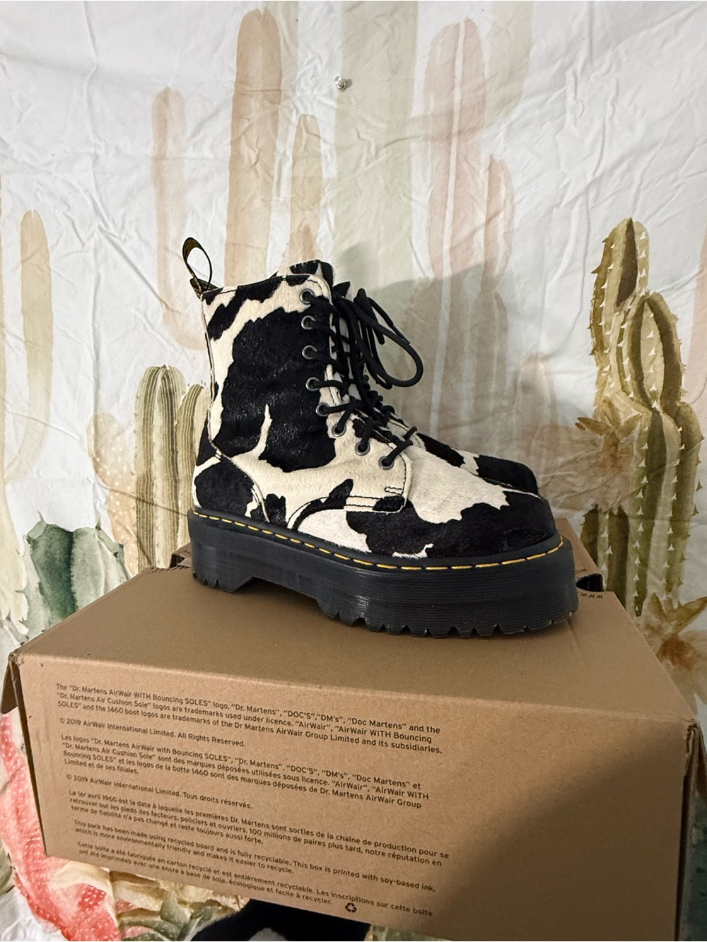 Dr. Martens Black and White Cow Print Platform Lace-Up Boots